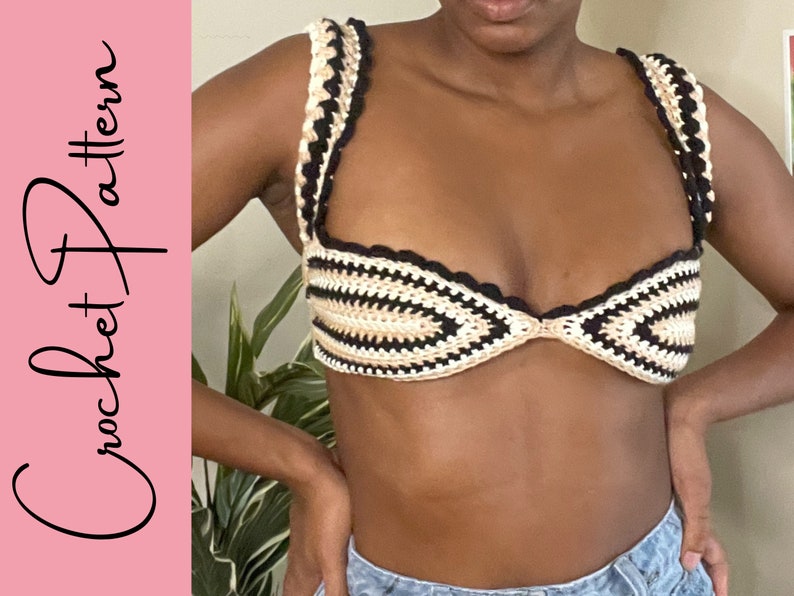 May include: A crocheted bikini top with black, white and beige stripes. The top has a scalloped edge and a tie closure at the back.