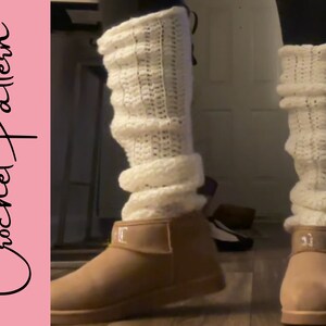 May include: Cream-colored crochet leg warmers worn over tan boots. The leg warmers are thick and textured, with a ribbed pattern. The words "Crochet Pattern" are written in a cursive font on a pink background.