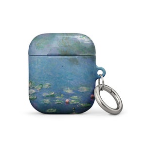 May include: A blue and green Airpods case with a water lily painting design and a silver metal keychain.