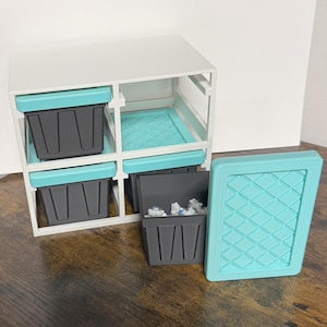 May include: A white ceramic mug with a black handle and the text "But first, coffee" in a handwritten style. The mug is on a white surface. The mug is 4 inches tall.