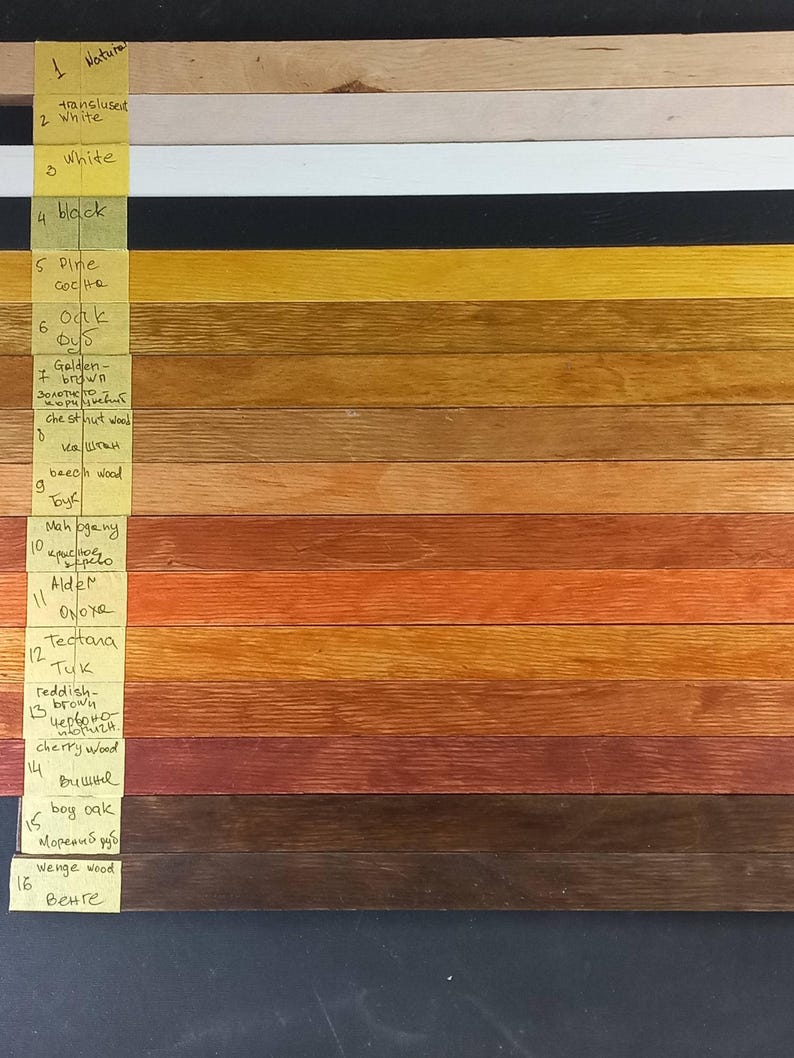 May include: A wood stain color chart with 16 different wood stains. The stains are labeled with their names and the corresponding wood type. The stains range in color from natural to black.