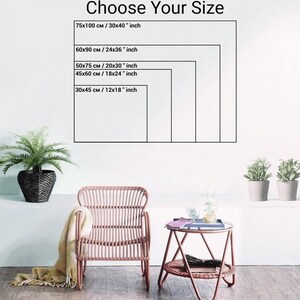 May include: The image displays a white wall with a framed size guide. The text "Choose Your Size" is at the top. The guide shows five rectangular frames with dimensions in both centimeters and inches, including 30x40 inches and 12x18 inches. A wicker chair and side table are in the foreground.