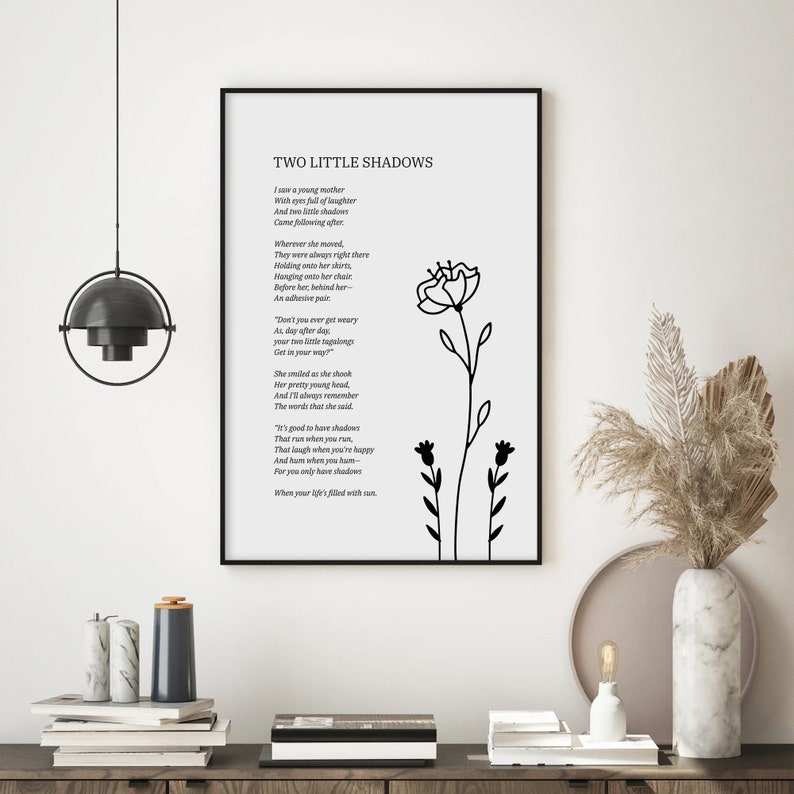 May include: Black and white printable wall art featuring a poem titled "Two Little Shadows" with a simple floral illustration. The poem is about a young mother and her two children.
