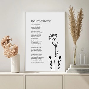 May include: Black and white printable wall art featuring a poem titled "Two Little Shadows" with a floral illustration. The poem describes a young mother with two children.