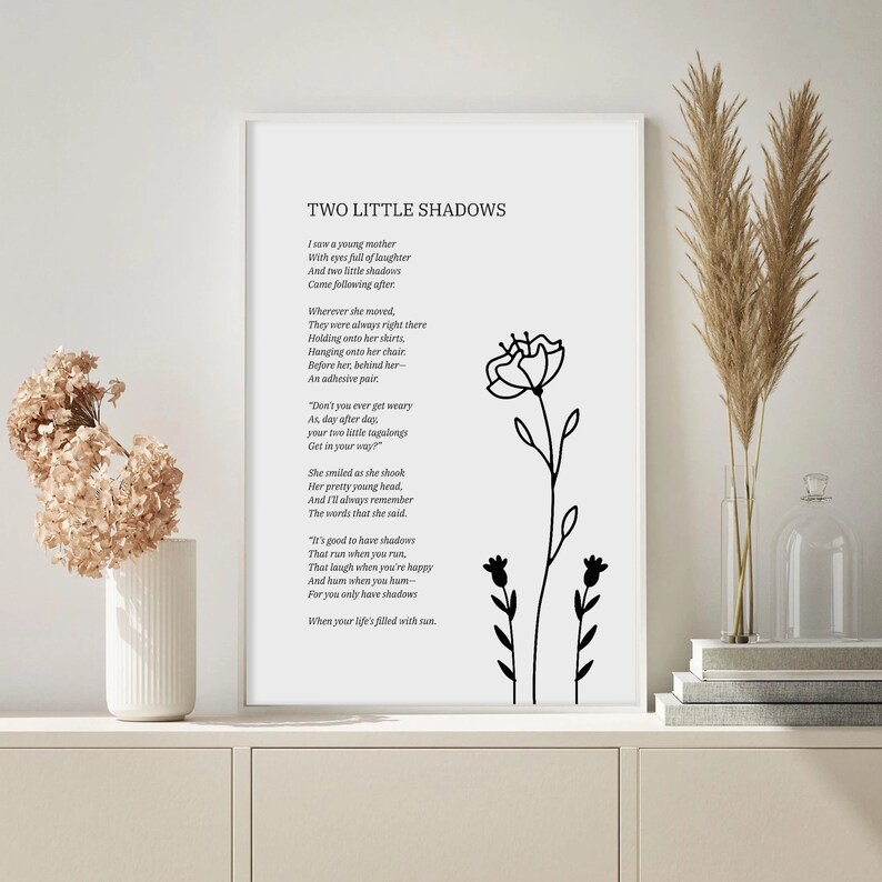 May include: Black and white printable wall art featuring a poem titled "Two Little Shadows" with a floral illustration. The poem describes a young mother with two children.