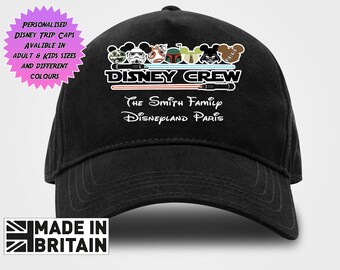 May include: Black baseball cap with the text "DISNEY CREW" and Disney character graphics. The text "The Smith Family Disneyland Paris" is also visible. The cap has the text "MADE IN BRITAIN" on the bottom.