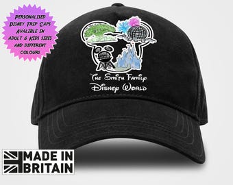 May include: A black baseball cap featuring a white graphic of a Mickey Mouse head outline containing illustrations of a tree, a geodesic dome, and a castle. Below the graphic, the text reads The Smith Family Disney World in a white script font.