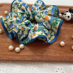 Floral Ruffle Scrunchie with Blue Trim – Handmade Hair Accessory with Vintage-Inspired Print