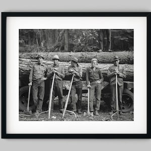Lumberjacks lean on forest logs with axes in Gem County, Idaho - Fine Art Print Wall Decor