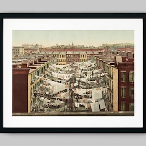 Laundry hanging on lines across apartment buildings of downtown Manhattan New York City USA Color Fine Art Print - Wall Decor