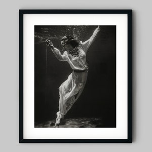 Fashion model wearing a white dress floats underwater Black and White Photography Fine Art Print - Wall Decor