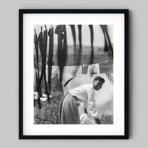 Portrait of a young African American woman surrounded by laundry in Rhode Island Black and White Photography Fine Art Print - Wall Decor