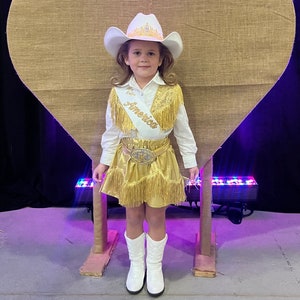 Gold pageant skirt and vest outfit with gold fringe