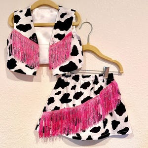 Girls western skirt and vest set made with black and white cow print fabric