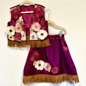 Girls satin wine colored rodeo pageant costume With floral appliqué and rhinestone accents.