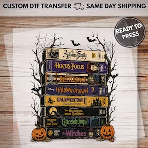 May include: A DTF transfer sheet featuring a stack of eight vintage VHS tapes with Halloween-themed movie titles including The Addams Family, Hocus Pocus, Beetlejuice, Halloweentown, The Nightmare Before Christmas, Goosebumps, and The Witches.