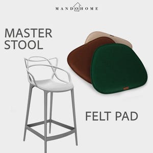 May include: A white Master Stool with a curved backrest and four legs, accompanied by three rounded felt pads in green, brown, and beige. The image includes the text MANDO HOME, MASTER STOOL, and FELT PAD, showcasing furniture accessories.