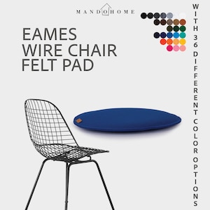 May include: A navy blue felt pad for an Eames wire chair. The image shows the pad with a black wire chair and a color chart with 36 different color options. The pad has a small brown leather tag.