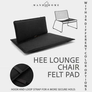 May include: A black felt pad for a Hee lounge chair, featuring a rectangular seat and back section. The text reads MANDO HOME, HEE LOUNGE CHAIR FELT PAD, WITH 36 DIFFERENT COLOR OPTIONS, and HOOK-AND-LOOP STRAP FOR A MORE SECURE HOLD.