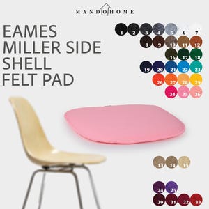 Peut inclure: Un coussin d'assise en feutre rose pour une chaise Eames Miller, présenté avec une chaise beige et un nuancier composé d'échantillons circulaires numérotés dans diverses teintes, notamment noir, gris, blanc, marron, vert, bleu, orange et rouge.