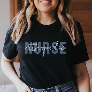 May include: A black t-shirt with the text "orthopedic nurse" in white lettering.