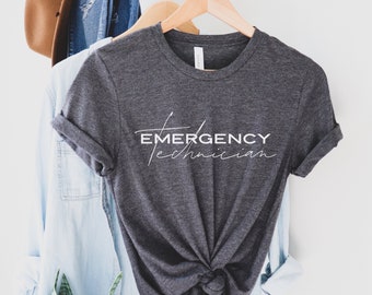 May include: A dark gray t-shirt with the text "EMERGENCY Technician" in white lettering.