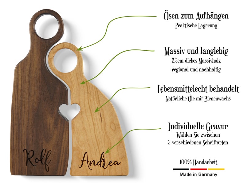 May include: Two wooden cutting boards, one brown and one light wood, are shaped like interlocking hearts. The boards have holes for hanging and are engraved with the names "Rolf" and "Andrea". The boards are made of 2.3 cm thick solid wood and are treated with food-safe oils and beeswax. They are 100% handmade in Germany.