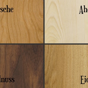 May include: Four wood samples, each with a different grain pattern and color. The samples are labeled "Kirsche", "Ahorn", "Walnuss", and "Eiche".