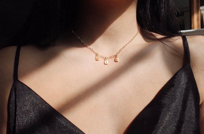 Backwards Gold Tiny Lock Necklace
