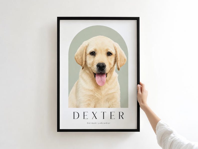 May include: A framed wall art print featuring a portrait of a light-colored Golden Labrador puppy centered within a sage green arch. The name DEXTER is printed in black capital letters below the dog, with Golden Labrador written underneath.