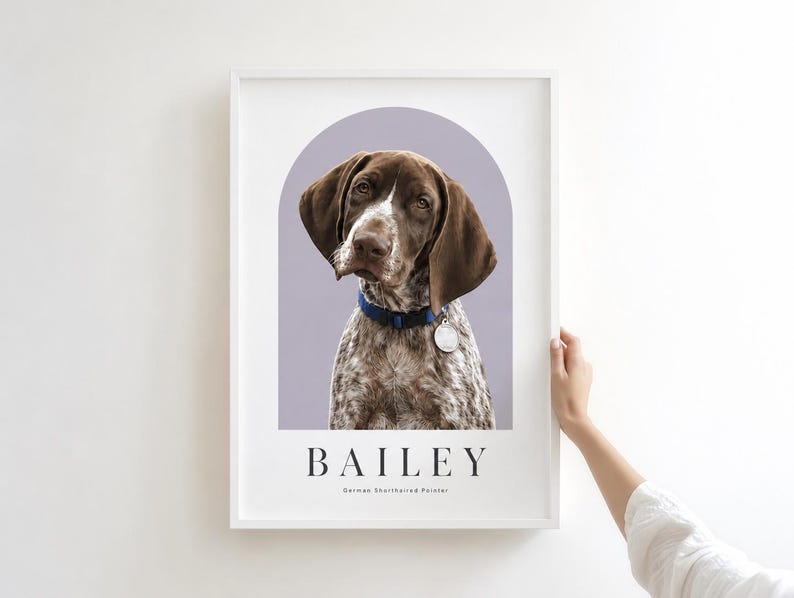 May include: A framed portrait print featuring a brown and white German Shorthaired Pointer dog with a blue collar and silver tag. The dog is centered within a light purple arch. The name BAILEY is printed in black below the arch.
