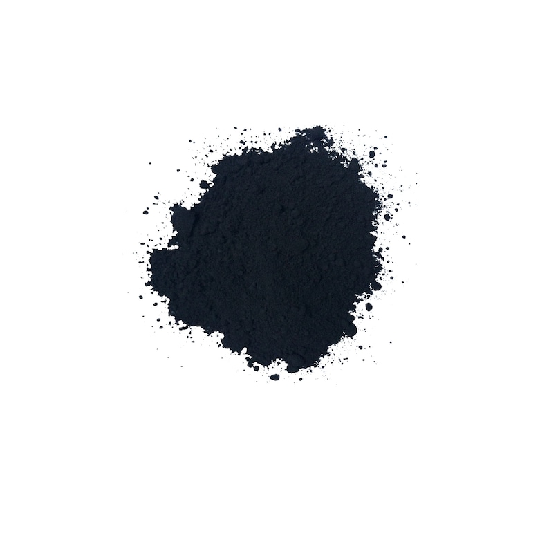 May include: A close-up of a pile of black powder. The powder is finely ground and has a smooth, even texture.