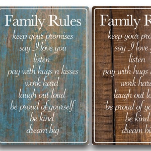 May include: Two rustic wooden signs with the text "Family Rules" and a list of rules written in white text. The signs have a distressed wood look and are painted in blue and brown.