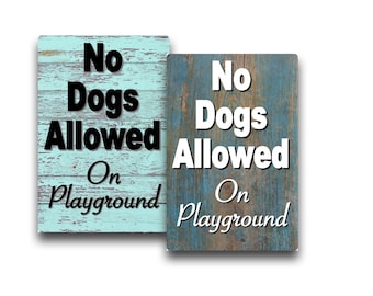 Cartel metálico "Prohibido el acceso a perros en el parque infantil" - Fondo estilo madera