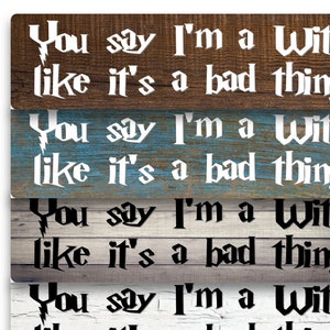 May include: Four wooden signs with the text "You say I'm a Witch like it's a bad thing." The signs are in different colors and wood grain patterns. The text is in white on a brown background, white on a blue background, black on a gray background, and black on a white background.