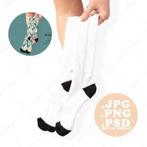 May include: A pair of white socks with black heels. The socks are being held by a hand. The image includes the text: .JPG .PNG .PSD Smart Object.