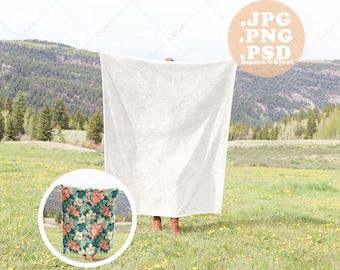 Velveteen Blanket Mockup held up by Person overlooking Meadow in the Mountains Vertical, Outdoors and Nature, PSD smart object, PNG, JPG