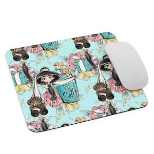 May include: A turquoise blue mouse pad with a repeating pattern of a woman wearing a black dress and a hat, holding a cup of coffee that says "I ♥ Coffee". The pattern also includes flowers, a cat, and a gift box.