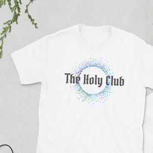 May include: White t-shirt with a blue and white graphic design that says "The Holy Club".
