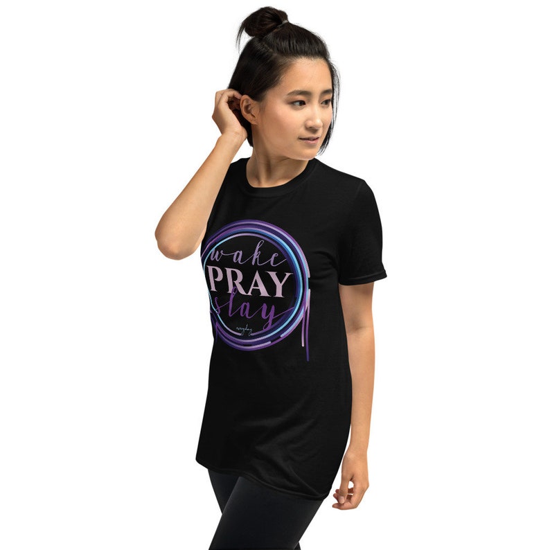 May include: Black t-shirt with a purple and blue circle graphic that says "wake PRAY stay".