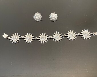 silver bracelet and earrings