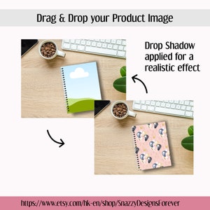 May include: Notebooks with spiral binding, one with a cloud and green landscape design, the other with a pink background and black and gold balloon pattern. The image also includes a keyboard, coffee, and the text "Drag & Drop your Product Image".