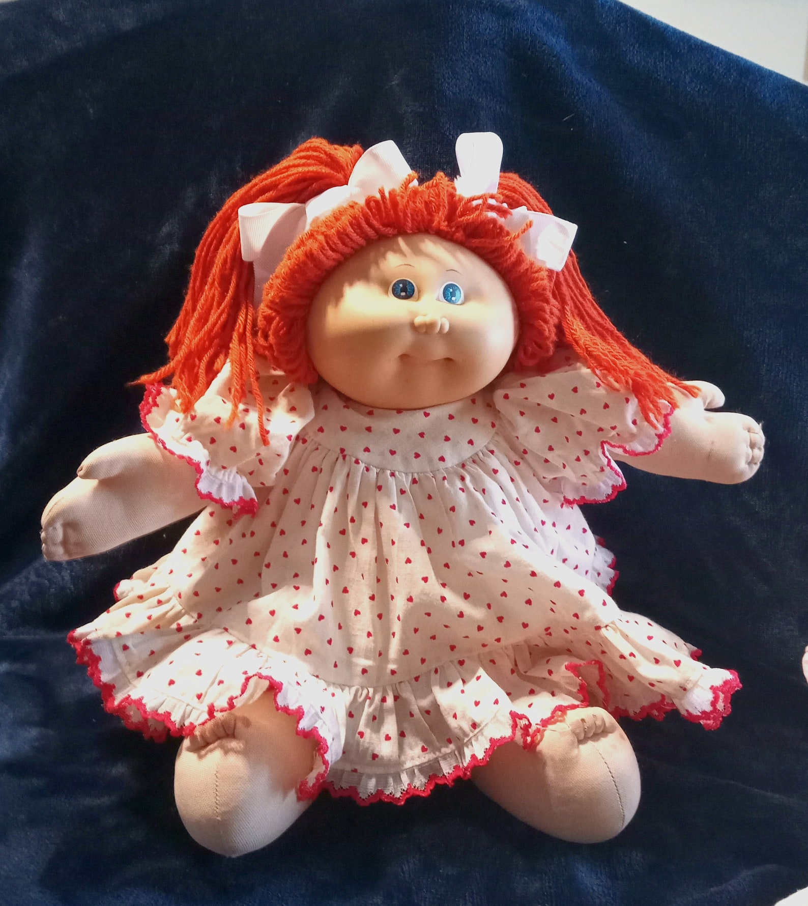 red fuzzy cabbage patch doll