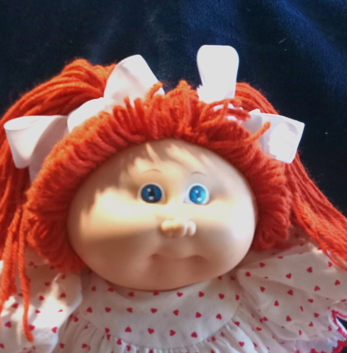 red fuzzy cabbage patch doll