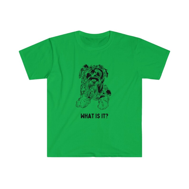 May include: A green t-shirt with a black and white illustration of a dog. The text "WHAT IS IT?" is printed below the dog.