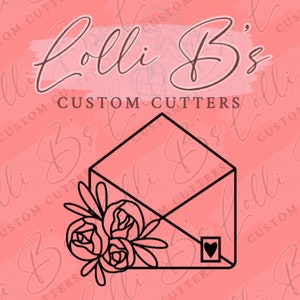 May include: A black and white line art illustration of an envelope with a floral design and a small heart on the front. The text "Colli B's CUSTOM CUTTERS" is written above the envelope.