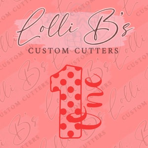 May include: Red polka dot number one with the word "one" in a cursive font. The background is pink with the text "Lolli B's Custom Cutters" repeated.