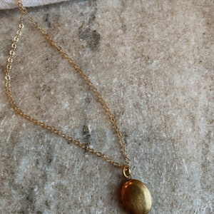 Oval brass locket