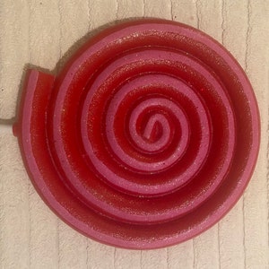 XXL red and pink swirled faux lollipop. 19 inches in diameter and 56 inches tall.