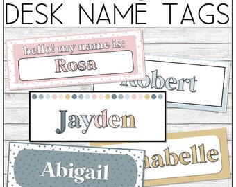 May include: A set of five desk name tags with a soft boho theme. The tags feature different colors and patterns, including pink, blue, and gold. The names on the tags are Rosa, Robert, Jayden, Abigail, and Labelle.